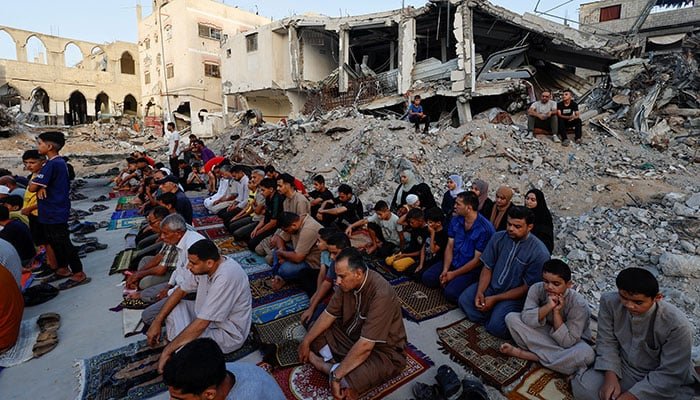 Photos: Palestinians perform Eid prayers on a pile of rubble in war-torn Gaza